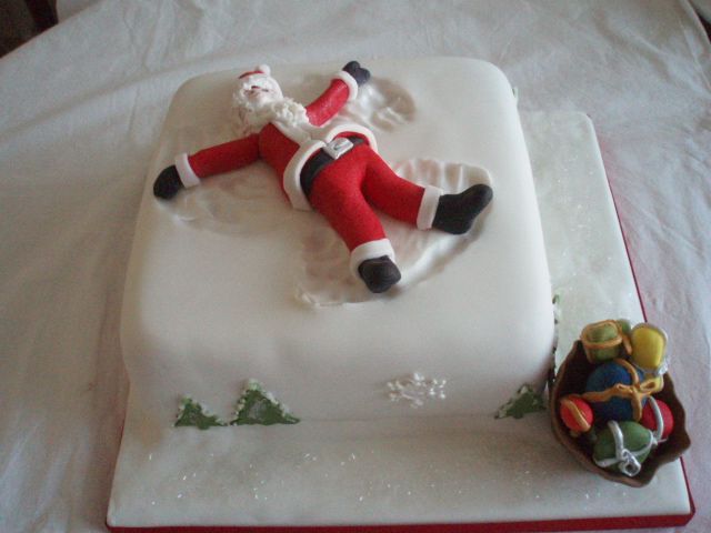 Santa making an Angel in the snow